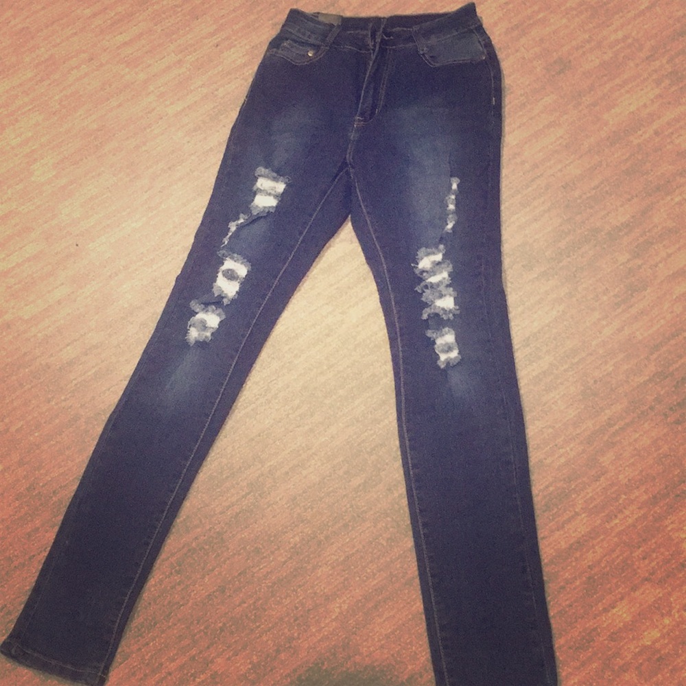 High waisted distressed dark blue jeans